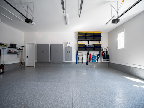 A neat and organized garage with storage.
