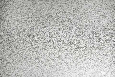 Full-frame image of a white stucco ceiling.