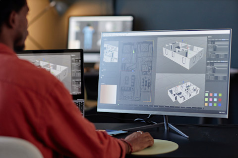 An interior design professional is looking through his 3D home plans.