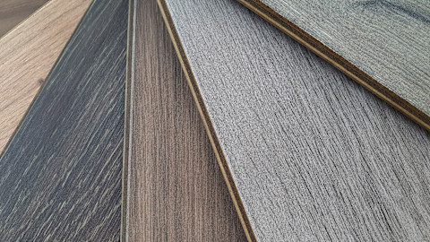 Closeup of different flooring samples displayed in a fan formation.