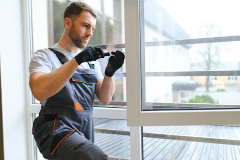 Man replacing a window