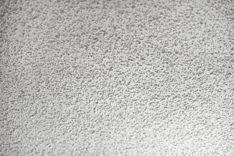 Full-frame image of a white stucco ceiling.