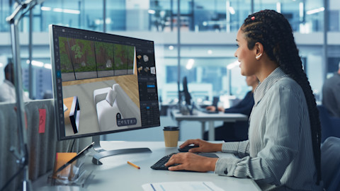 An interior designer is looking through her 3D plans.